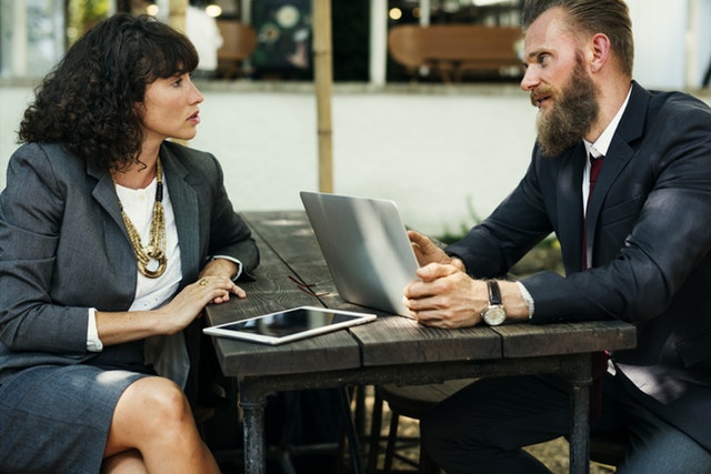 business man and woman chatting