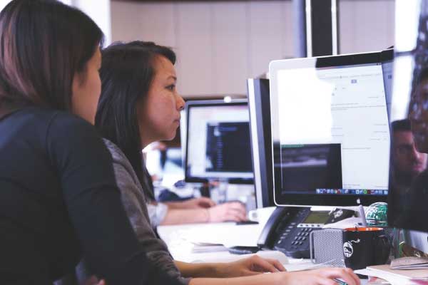 women looking at computer